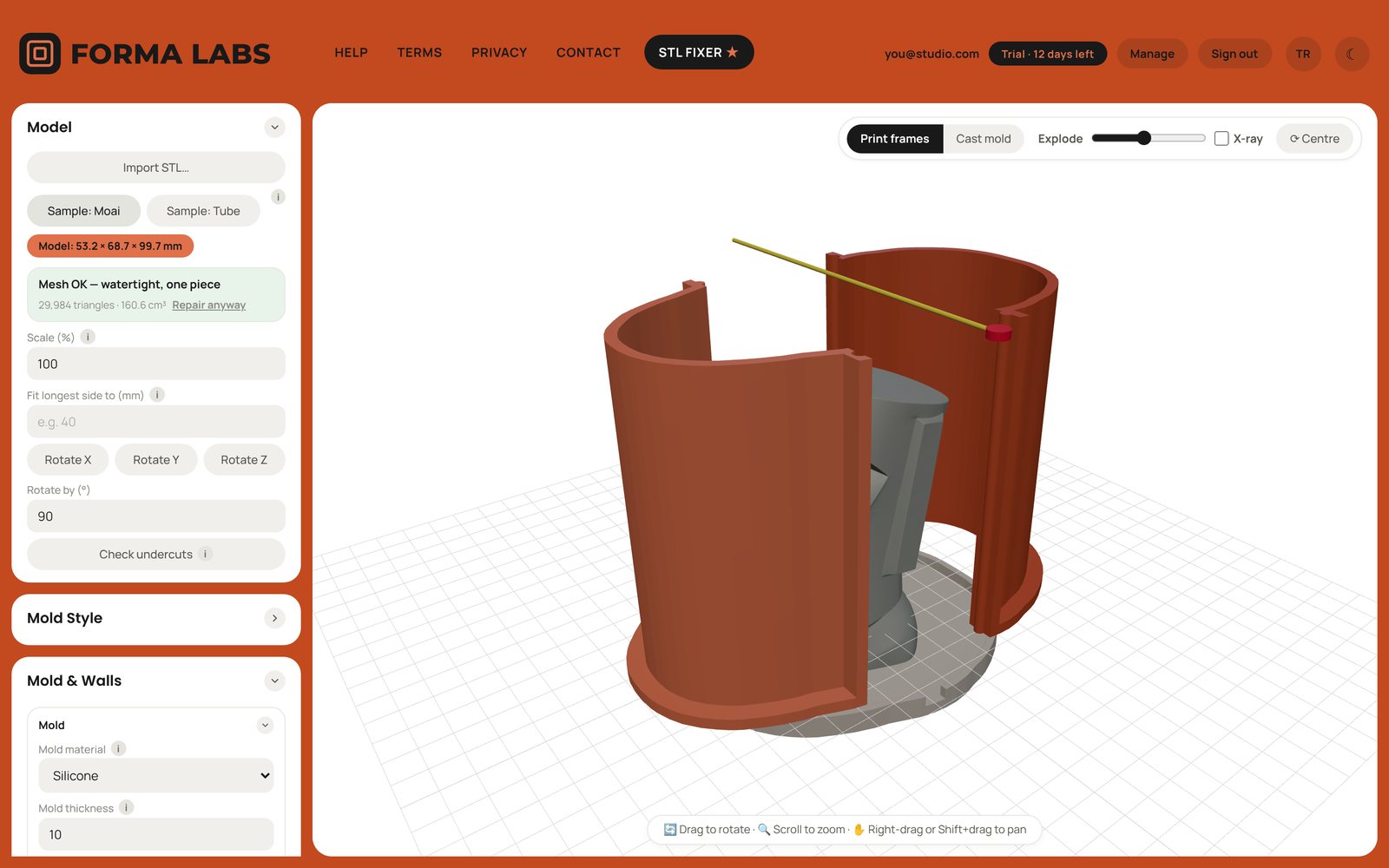 The FORMA LABS app: a contoured silicone mold frame around a moai head